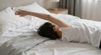 Feeling the Sunday Night Dread? Try This Simple Stretch That You Can Do in Bed.